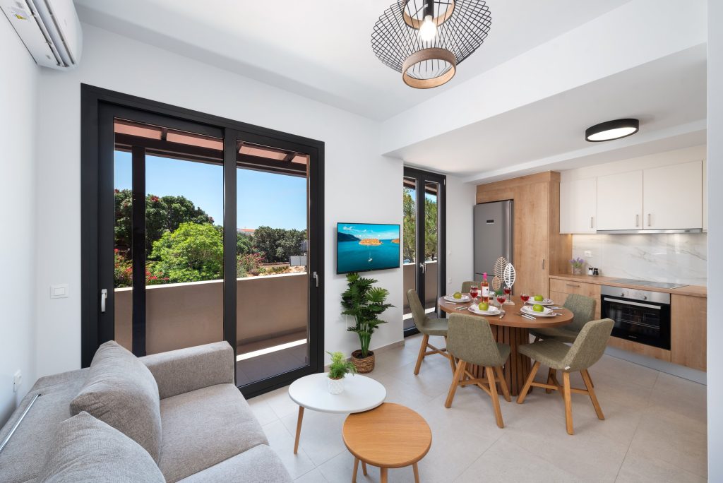 Welcome to your perfect getaway in Plaka, Elounda! This stylish and modern 2-bedroom apartment, located on the first floor and accessible only by stairs, offers a relaxing retreat just moments from the crystal-clear waters of the Aegean.